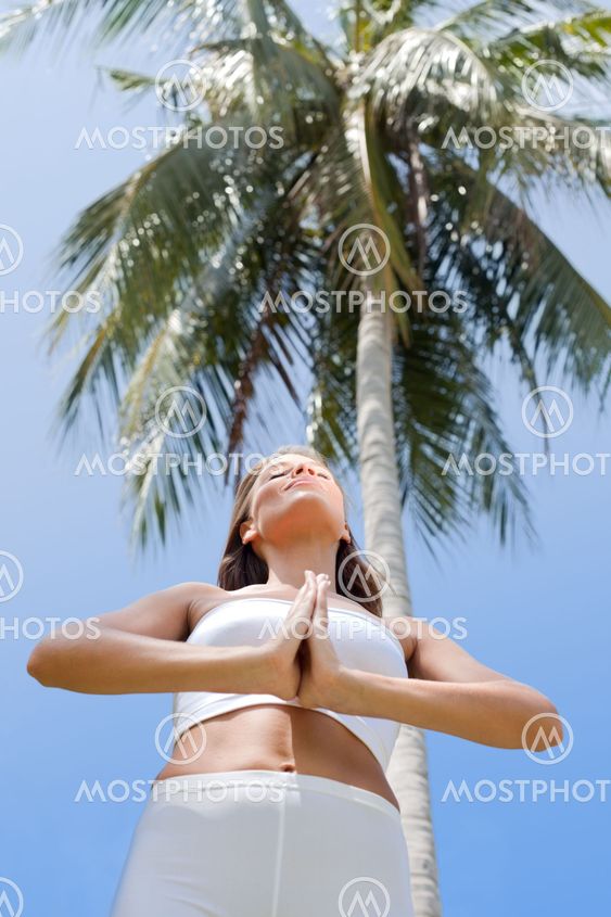 view on slim woman doing yoga