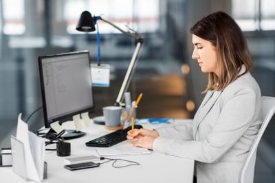 businesswoman with notebook working at office