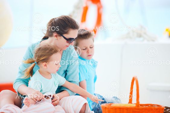 Mother and kids at luxury yacht