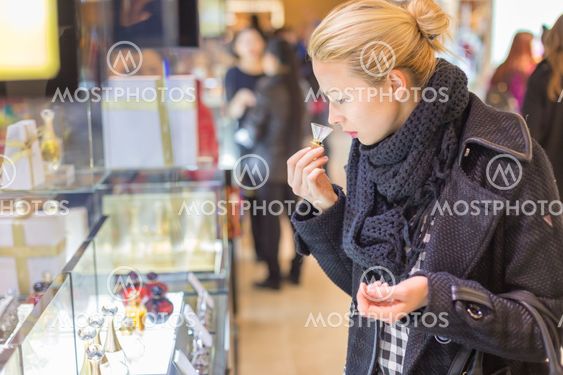 Beautiful woman shopping in beauty store.