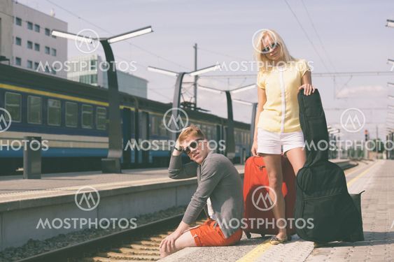 Young Couple Waiting at Train Station