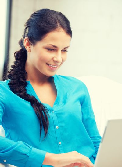 happy woman with laptop computer