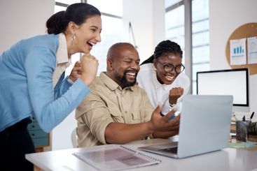 Business, people and celebration with laptop at desk for...