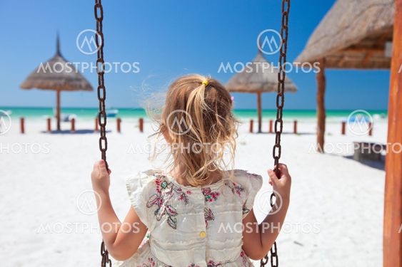 Little girl swinging