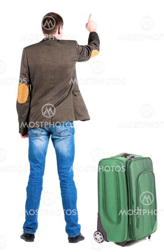Back view of pointing business man in jacket traveling...