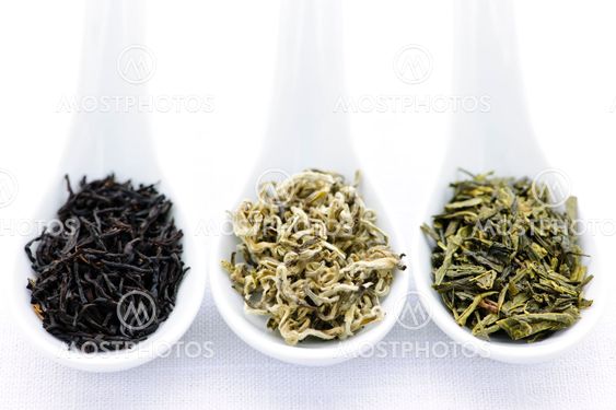 Assortment of dry tea leaves in spoons
