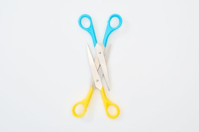 top view of colourful scissors isolated on white