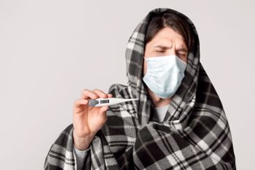 Man on quarantine. Self isolation with high temperature