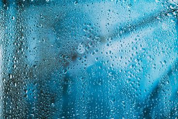 Drops Of Water Or Rain On Wet Glass Background. Moody...