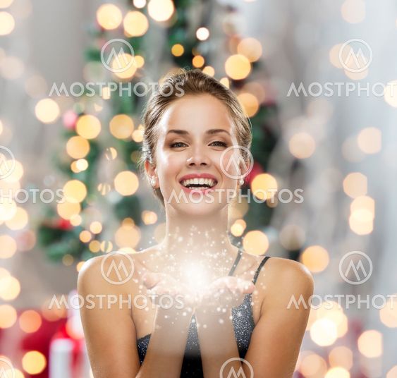 laughing woman in evening dress holding something