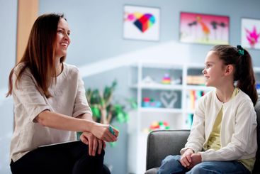 Young Child Therapist Comforts Depressed Kid During...