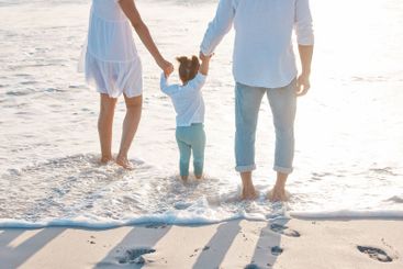 Beach, mother and father with child for holding hands,...
