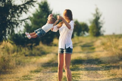 mother and daughter on a rural road