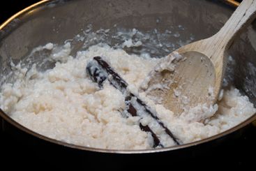 Swedish classic rice pudding with cinnamon stick in a...
