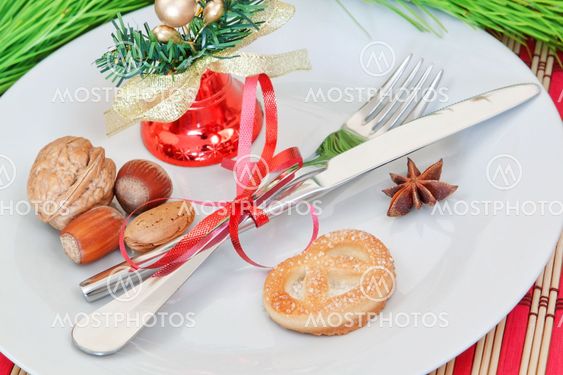 Arrangement of Christmas objects, bells, and nuts.