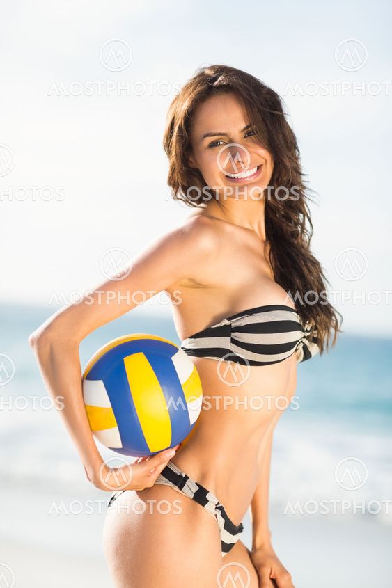 Woman holding volley ball