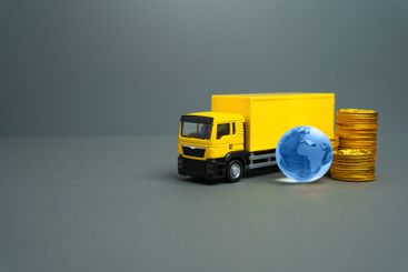 Yellow truck with globe and money coins. International...