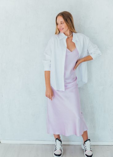 Beautiful slim fashion blonde woman in summer silk dress