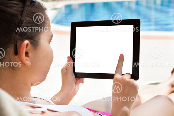 Woman Using Digital Tablet At Resort