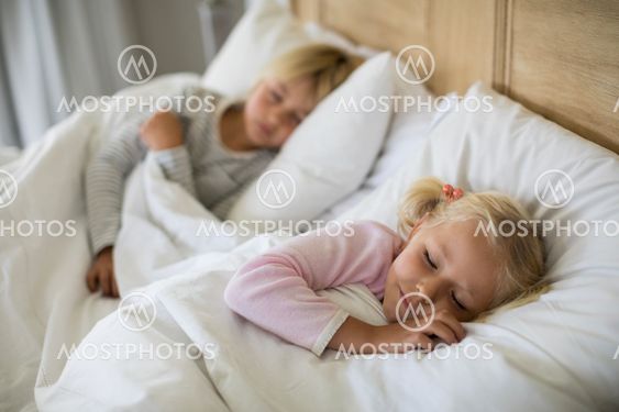 Girl sleeping in the bedroom