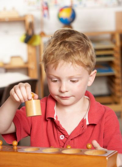 Young Boy Playing at Montessori/Pre-School