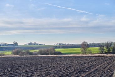 Farm, field and soil in rows, landscape and outdoor for...