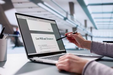 woman digitally signing her last will