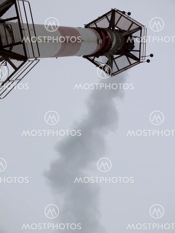 industrial smoke from chimney on sky