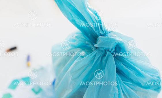 close up of rubbish bag with trash at home