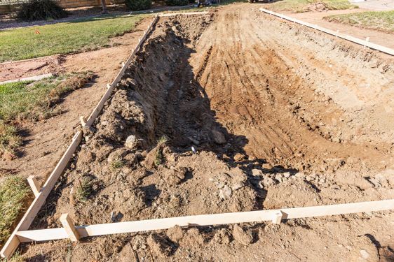 Freshly Dug Hole In Yard Preparing For Swimming Pool...