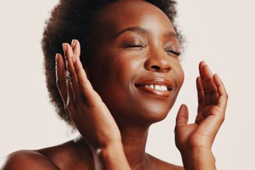 Happy, skincare and woman with glow, studio and...
