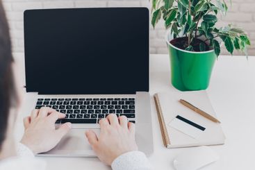 Businessman at work. Close-up top view of man working on...