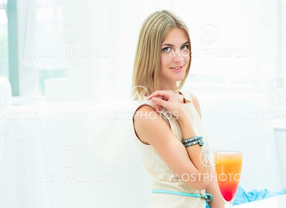 Portrait of a cute woman in a city cafe