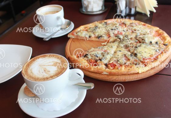 Pizza and coffee cup