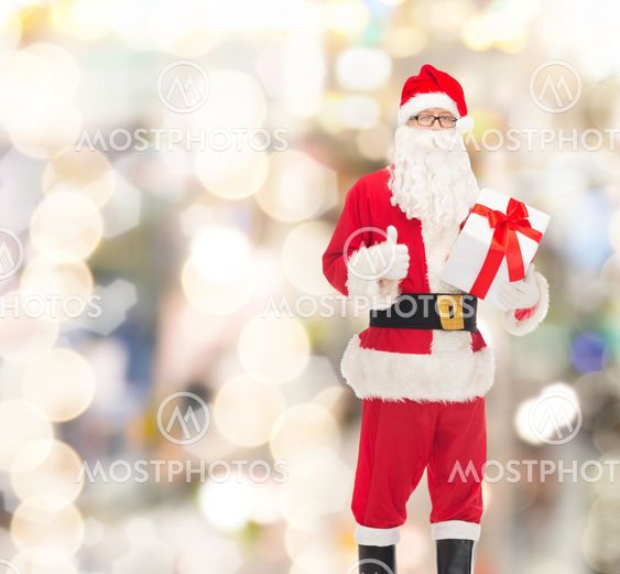 man in costume of santa claus with gift box
