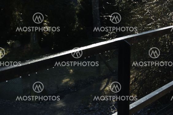 Icy metal transom in railing
