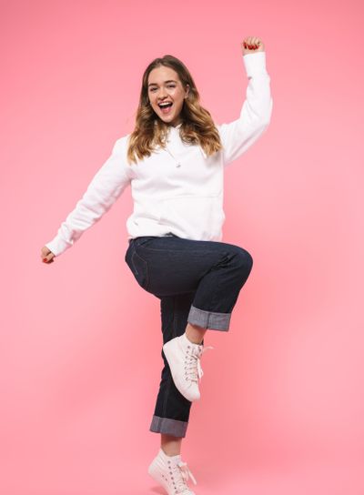 Full length image of Cheerful woman wearing in casual...