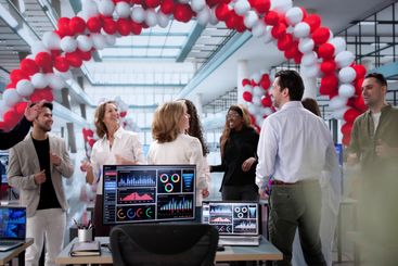 Celebration of Job Success: Diverse Business Team Dancing