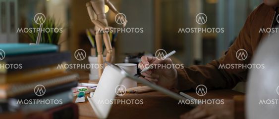 Female college student doing assignment with digital...