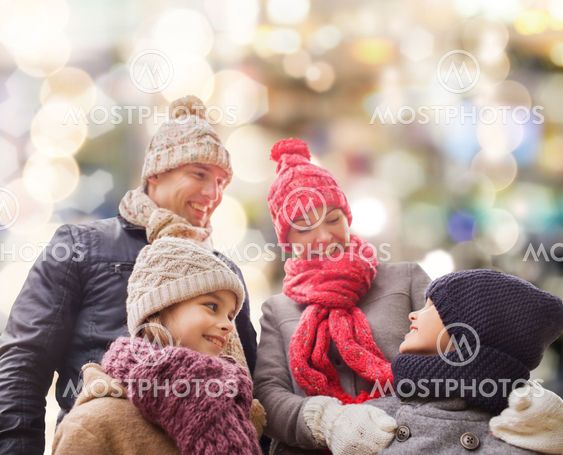 happy family in winter clothes outdoors