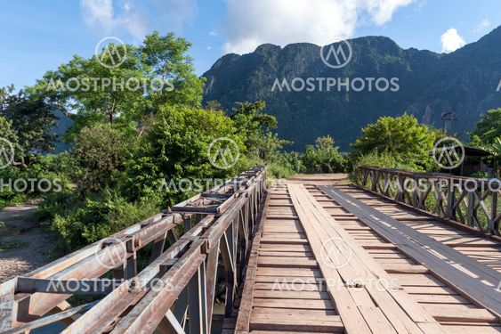 Wooden bridge in Vang Vieng, popular tourist resort town in Lao PDR.