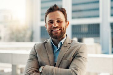 Arms crossed, business and portrait of happy man in city...