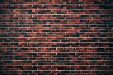 Texture of a building facade decorated with brick slips