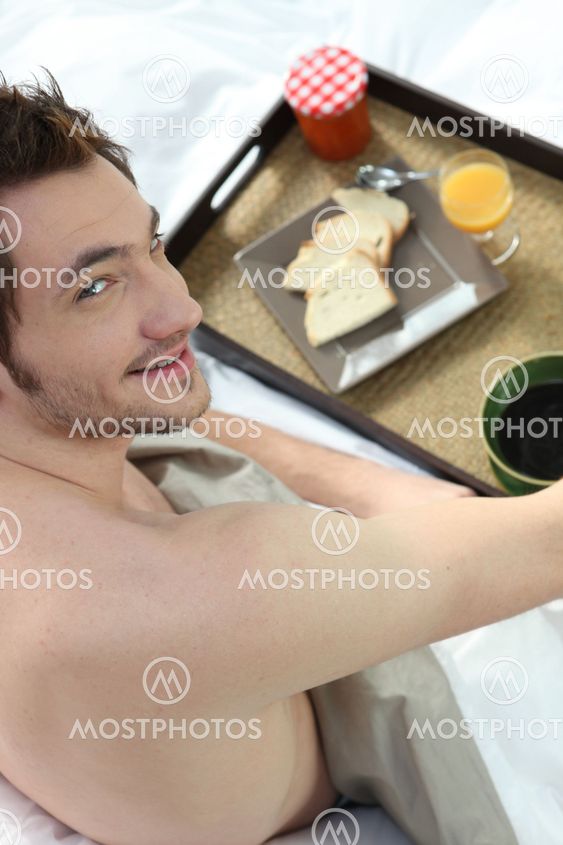 man having breakfast in his bed