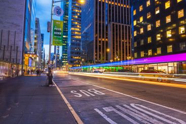 Evening cityscape of New York with yellow taxi 