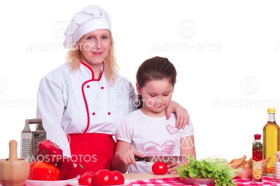 Mother and daughter cooking dinner