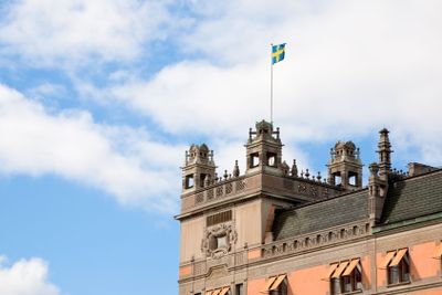 Swedish flag on roof of old house in Stockholm