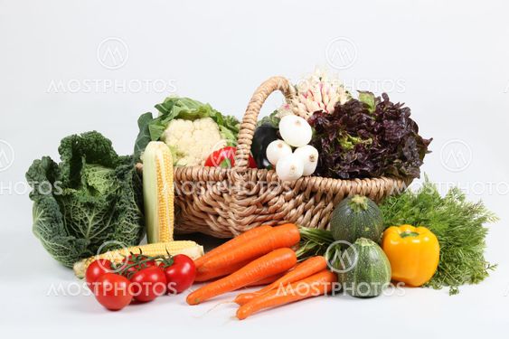 Basket of vegetables on white background