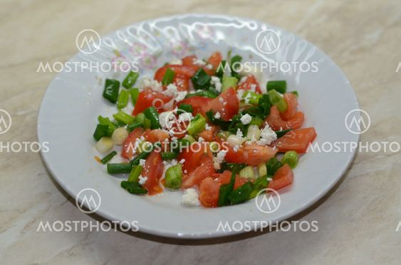 Salad with tomatoes, cheese and onions