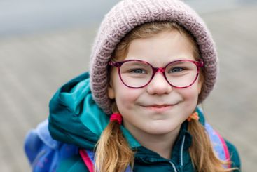 Cute little girl o the way to school. Healthy happy...